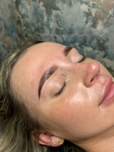 Beauty student applying hybrid brow dye for skin-stained, bold brows during London Brow online training.