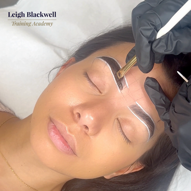 Online brow course showing student applying tinted liquid stain for bold, long-lasting brow definition.